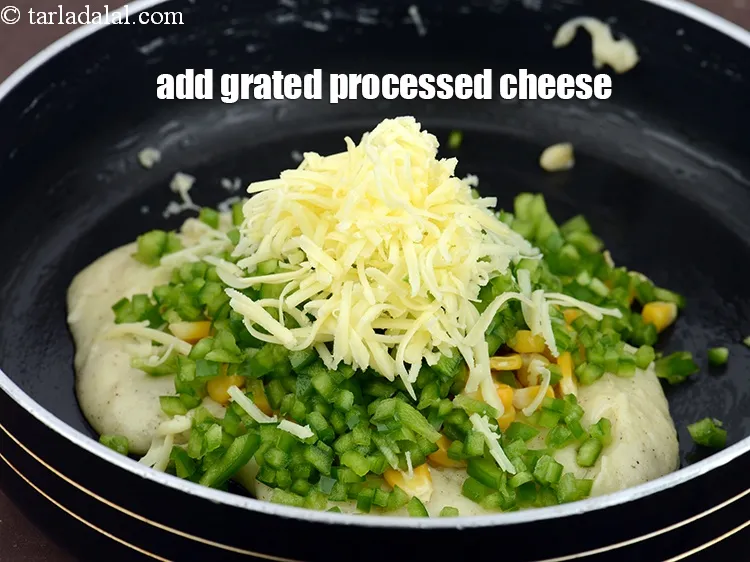 Step 15 – Add 1/4 cup&nbsp;<a href="https://www.tarladalal.com/glossary-grated-processed-cheese-868i">grated processed cheese</a>.