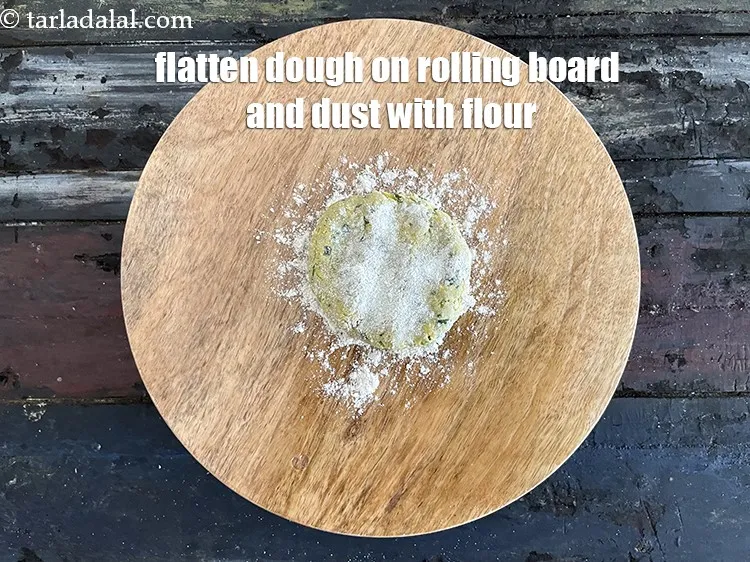 Step 18 – <meta charset="UTF-8" />Flatten the dough on a rolling board and dust with whole wheat flour.&nbsp;
