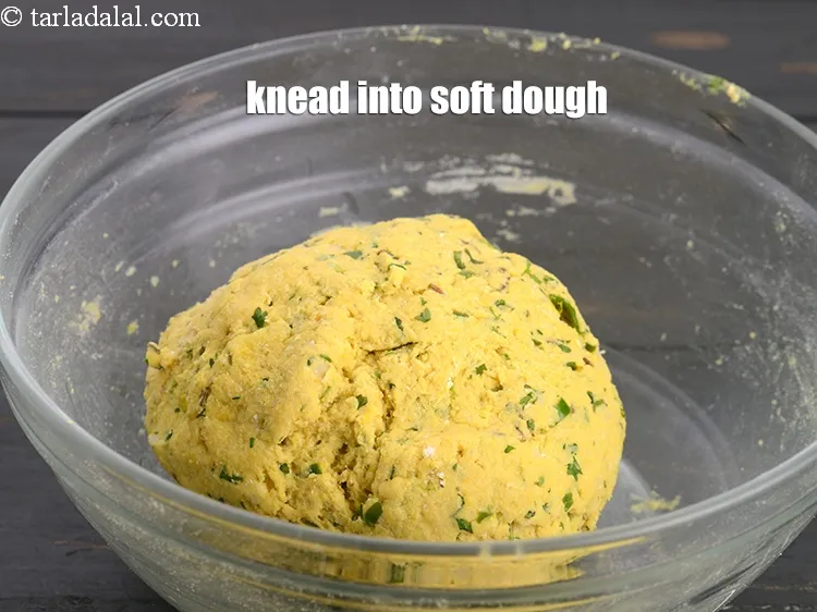 Step 13 – Add 1/3 cup water. Knead into a soft dough.