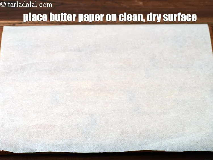 Step 14 – Place a butter paper on a clean, dry surface.