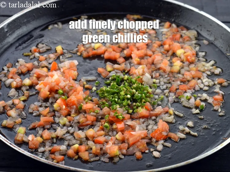 Step 15 – Add the 1 tsp finely <a href="https://www.tarladalal.com/glossary-chopped-green-chilli-820i">chopped green chillies</a>.