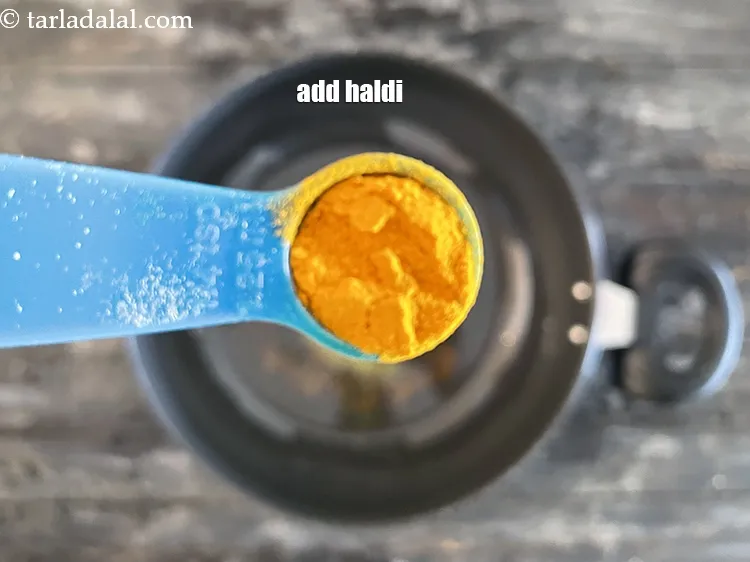 Step 14 – Add&nbsp;<meta charset="UTF-8" />1/4 tsp&nbsp;<a href="glossary-turmeric-powder-haldi-645i">turmeric powder (haldi)</a>.