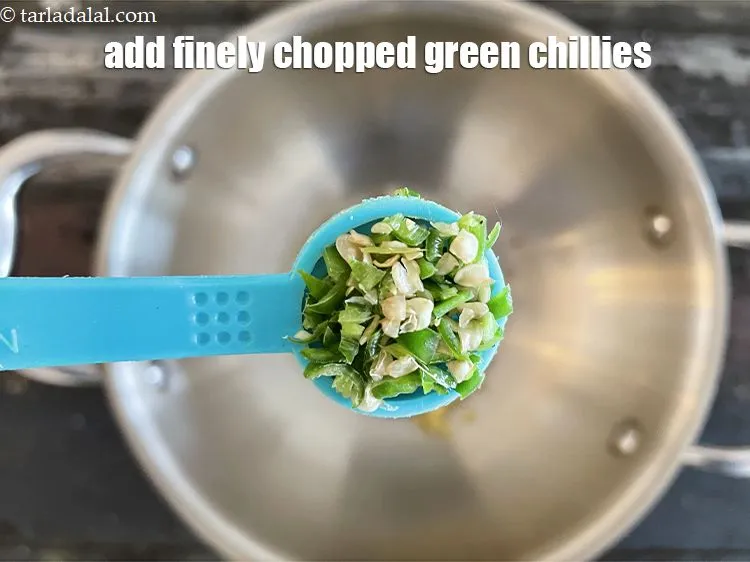 Step 24 – Add&nbsp;1/2 tsp&nbsp;finely&nbsp;<a href="glossary-chopped-green-chilli-820i">chopped green chillies</a>.