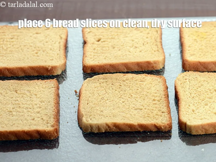 Step 15 – Place 6&nbsp;<a href="https://www.tarladalal.com/glossary-whole-wheat-bread-gehun-ka-bread-855i">whole wheat bread</a>&nbsp;slices on clean, dry surface.