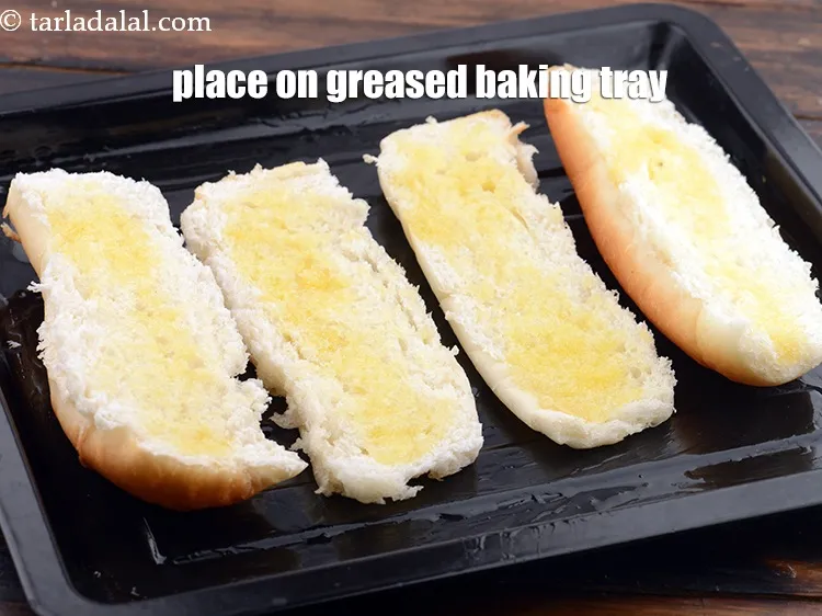 Step 16 – Place them on a greased baking tray.