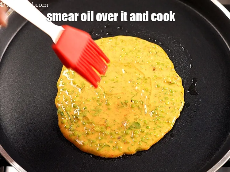 Step 15 – Smear &frac12; tsp of oil over it and along the edges and cook on a …