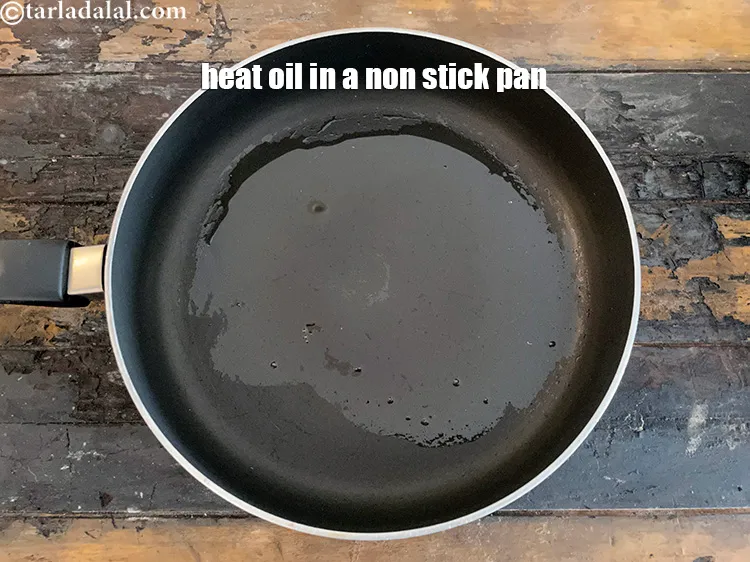 Step 28 – Heat 1 1/2 tbls oil in a broad non-stick pan.