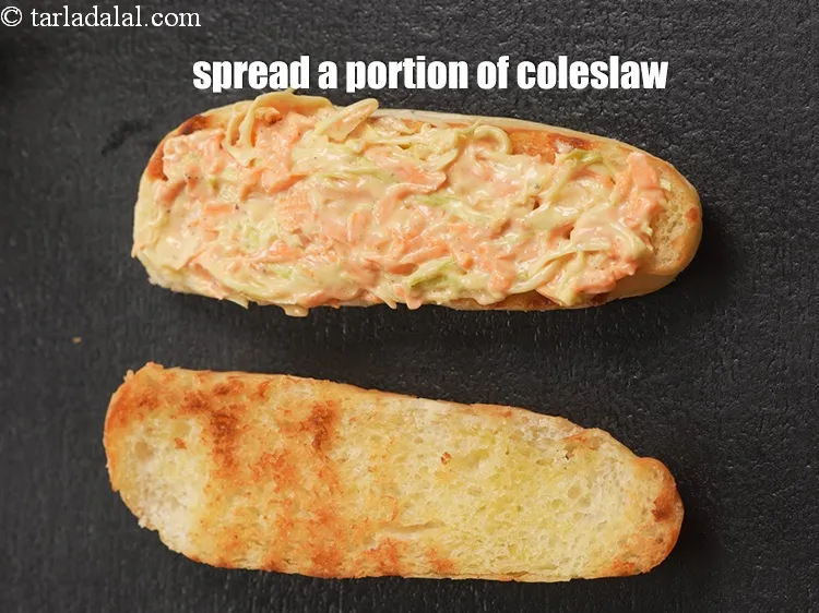 Step 15 – Spread a portion of the coleslaw evenly over it.&nbsp;