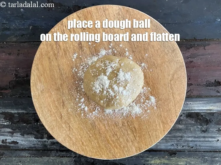 Step 16 – Place a portion of the dough on it and flatten it.