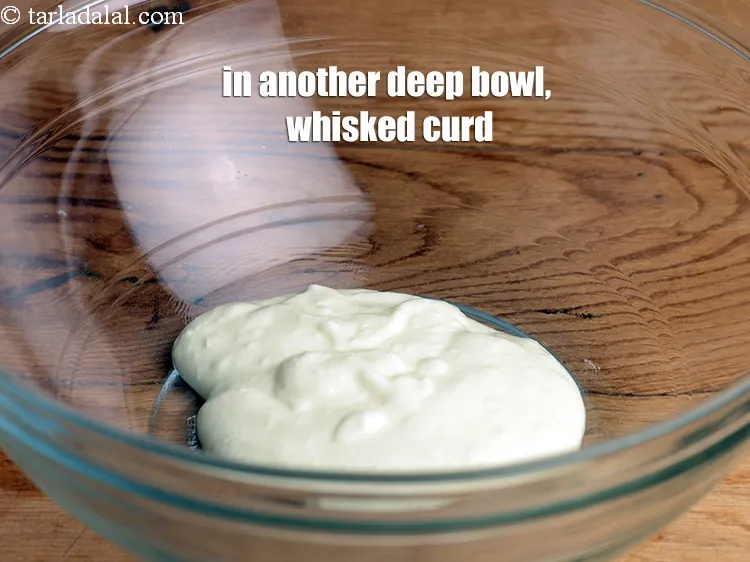 Step 18 – For the second marination, in another deep bowl, Add 5 tbsp whisked <a href="https://www.tarladalal.com/glossary-curd-dahi-yogurt-yoghurt-383i">curd (dahi)</a>.