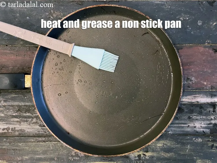 Step 31 – <meta charset="UTF-8" />Heat and grease non-stick pan using &frac14; tsp of oil.