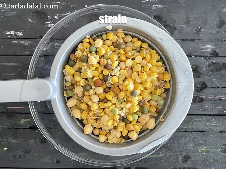 Step 16 – Strain the dal and sprouts mixture.