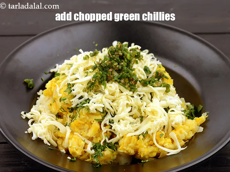 Step 16 – Add 2 tsp&nbsp;finely&nbsp;<a href="https://www.tarladalal.com/glossary-chopped-green-chilli-820i">chopped green chillies</a>.&nbsp;