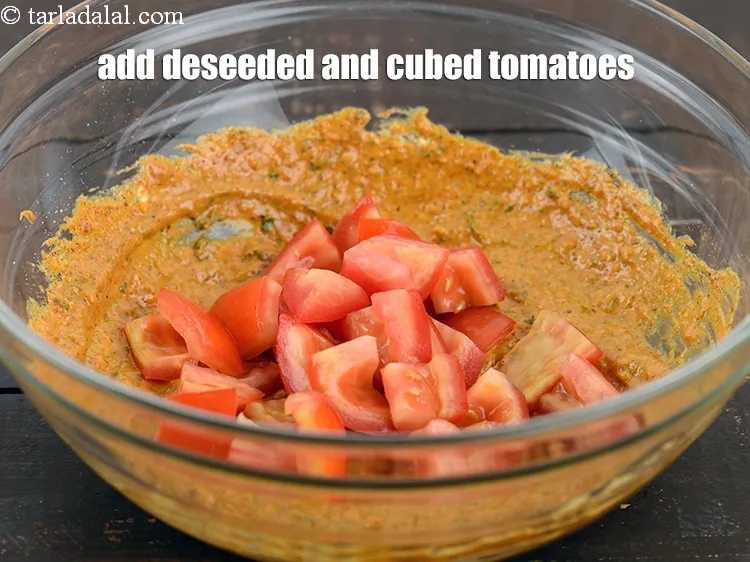 Step 16 – Add &frac12; cup <a href="https://www.tarladalal.com/glossary-tomato-cubes-728i">deseeded and cubed tomato</a>.