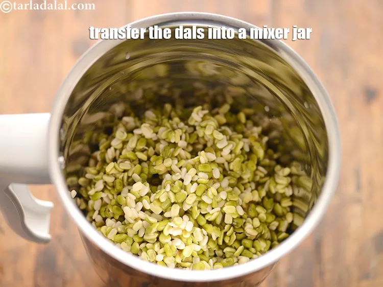 Step 24 – Transfer the soaked and drained dal into a mixer jar.&nbsp;