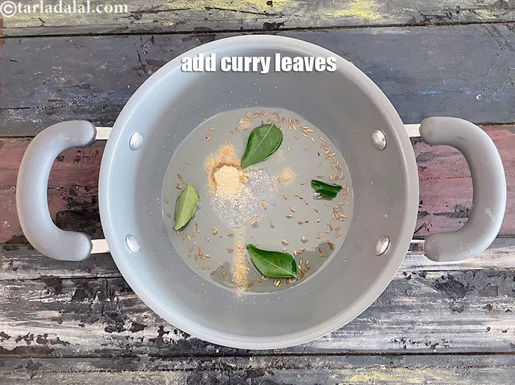 Step 19 – Add&nbsp;<meta charset="UTF-8" />3 to 4&nbsp;<a href="glossary-curry-leaves-kadi-patta-kadipatta-388i">curry leaves (kadi patta)</a>.