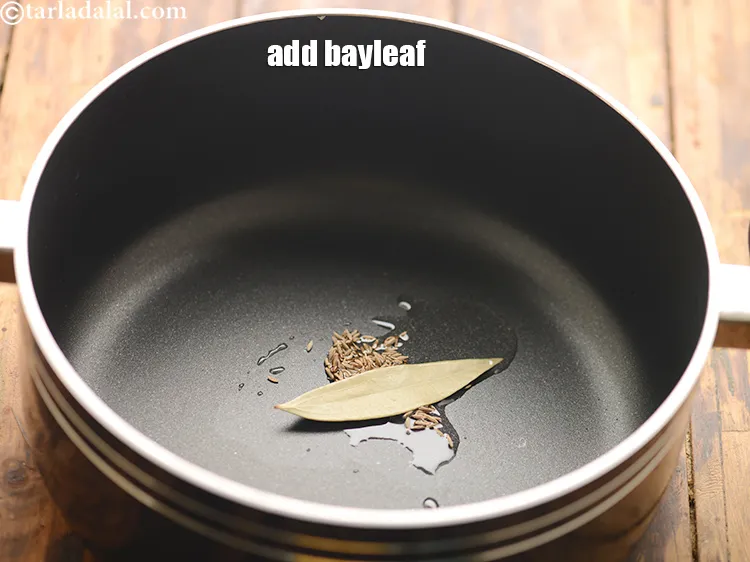 Step 30 – Add 1&nbsp;<a href="https://www.tarladalal.com/glossary-bayleaf-tejpatta-tej-patta-189i">bayleaf (tejpatta)</a>.
