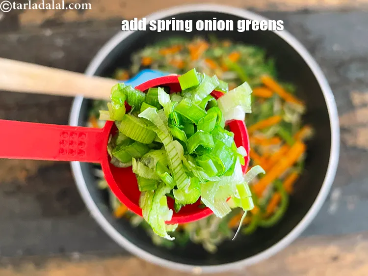 Step 23 – Add&nbsp;<meta charset="UTF-8" />2 tbsp&nbsp;finely&nbsp;<a href="glossary-chopped-spring-onion-greens-1030i">chopped spring onion greens</a>.