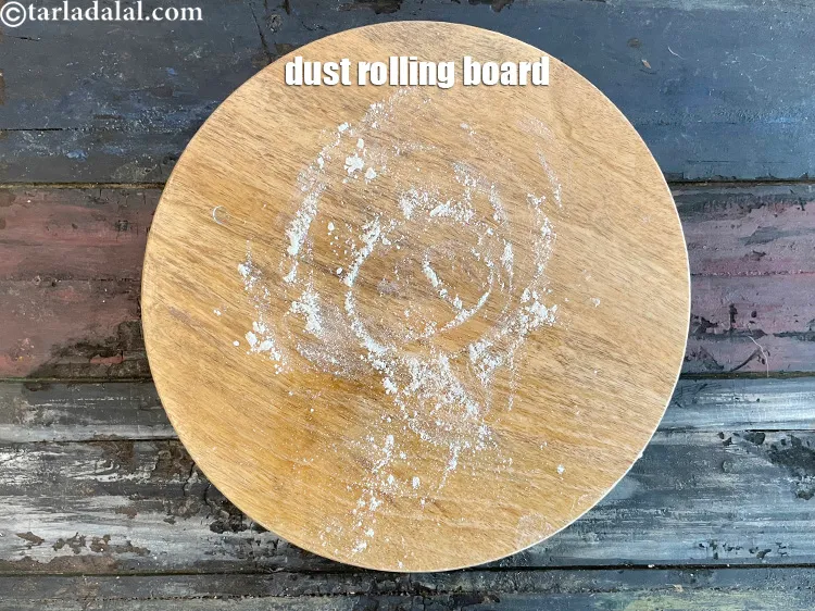 Step 12 – <meta charset="UTF-8" />Dust a rolling board with whole wheat flour.&nbsp;