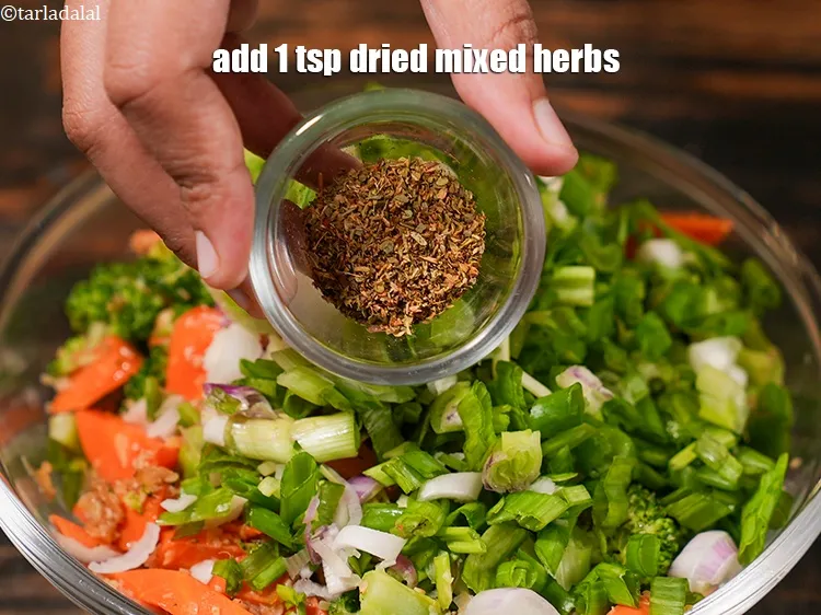 Step 24 – Add 1 tsp&nbsp;<a href="https://www.tarladalal.com/glossary-dried-mixed-herbs-466i">dried mixed herbs</a>.