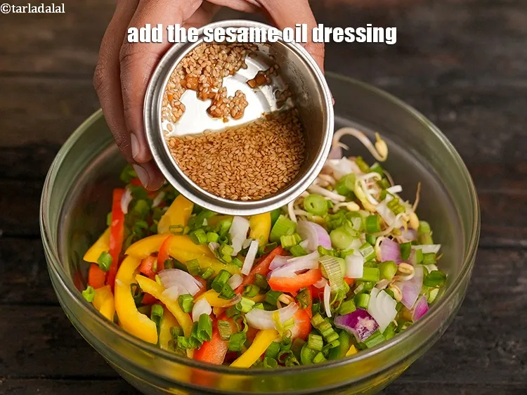 Step 16 – Add the sesame oil dressing to the salad.&nbsp;