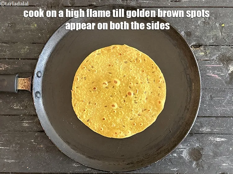 Step 16 – Cook on a <strong>high flame&nbsp;</strong>till golden brown spots appear on both the sides.