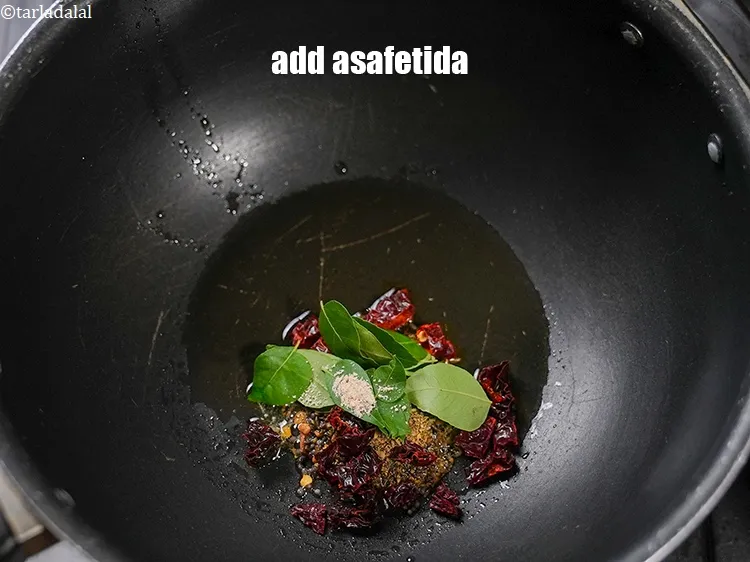 Step 16 – Add a pinch of asafetida.