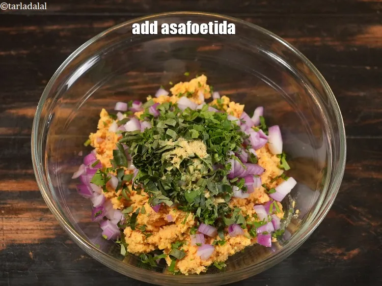 Step 16 – Add 1/4 tsp <a href="https://www.tarladalal.com/glossary-asafoetida-hing-113i">asafoetida (hing)</a>.