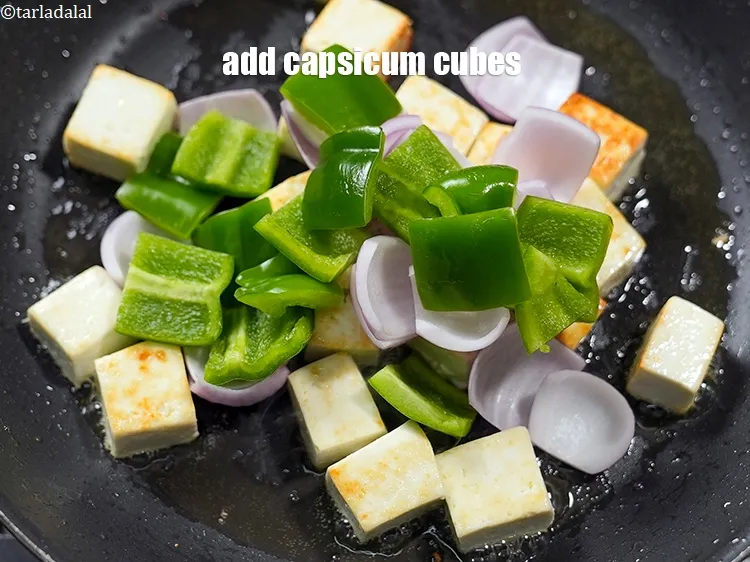 Step 17 – <p>Add ½ cup <a href="https://www.tarladalal.com/glossary-capsicum-cubes-170i">capsicum cubes</a>.</p>