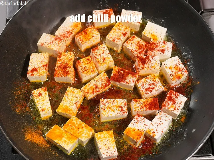 Step 16 – Add &frac14; tsp <a href="https://www.tarladalal.com/glossary-chilli-powder-red-chilli-powder-339i">chilli powder</a>.