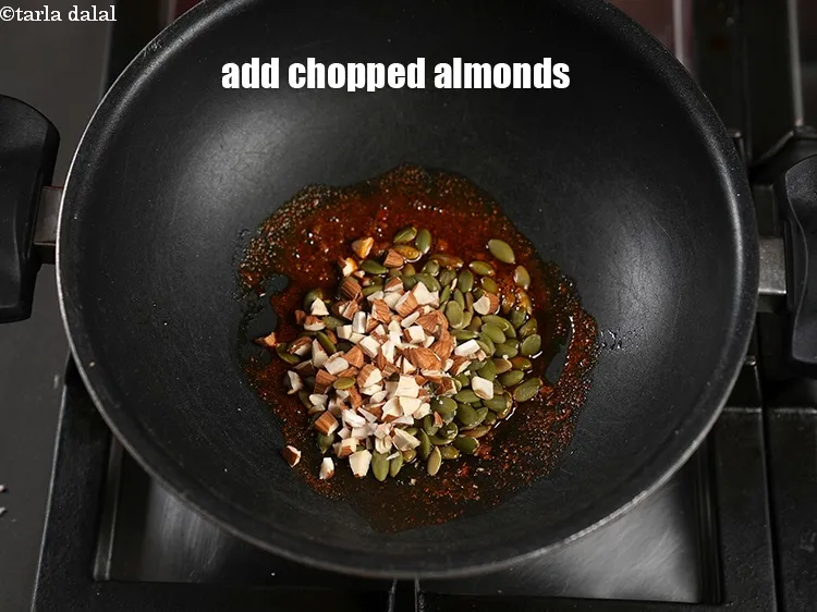 Step 16 – Add 2 tbsp <a href="https://www.tarladalal.com/glossary-chopped-almonds-865i">chopped almonds (badam)</a>.