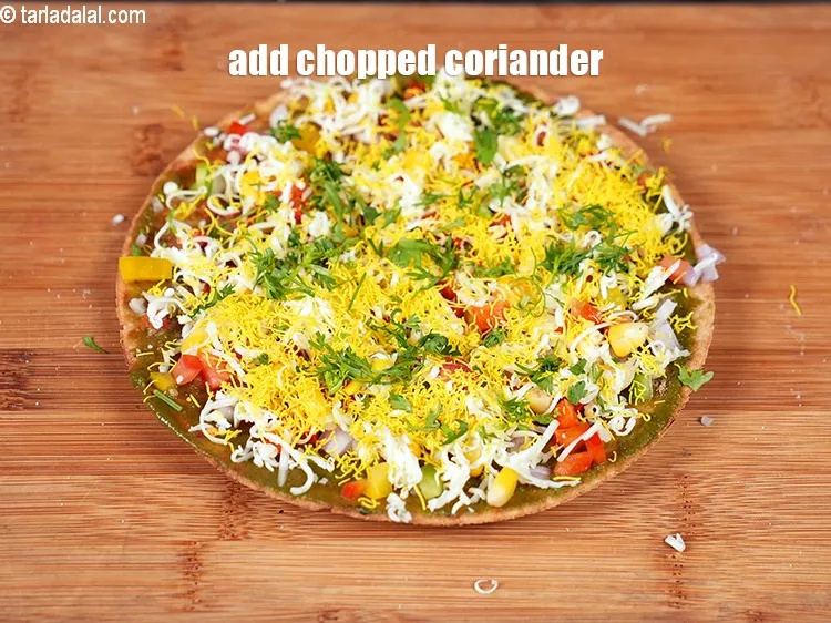 Step 16 – Add 1 tsp finely chopped coriander evenly over it.&nbsp;