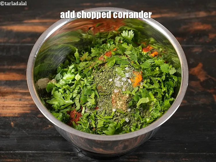 Step 16 – Add 2 tbsp <a href="https://www.tarladalal.com/glossary-chopped-coriander-783i">chopped coriander (dhania)</a>.