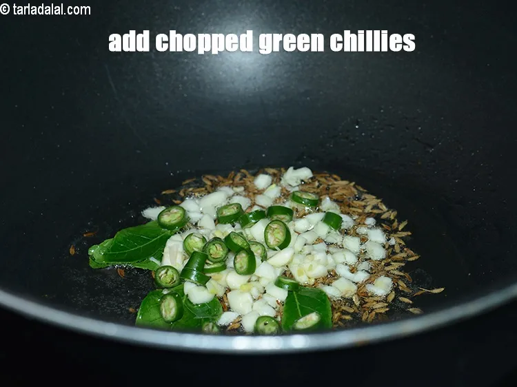 Step 16 – Add &frac12; tsp <a href="https://www.tarladalal.com/glossary-chopped-green-chilli-820i">chopped green chillies</a>.