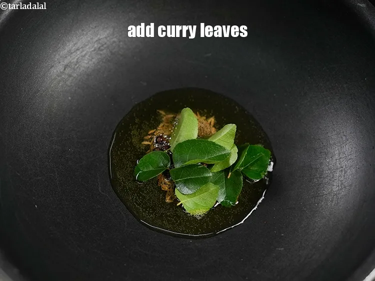 Step 16 – Add 7 to 8 curry leaves.