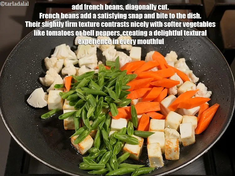 Step 16 – Add &frac34; cup <a href="https://www.tarladalal.com/glossary-french-beans-fansi-196i">french beans</a>, diagonally cut. French beans add a satisfying snap and …