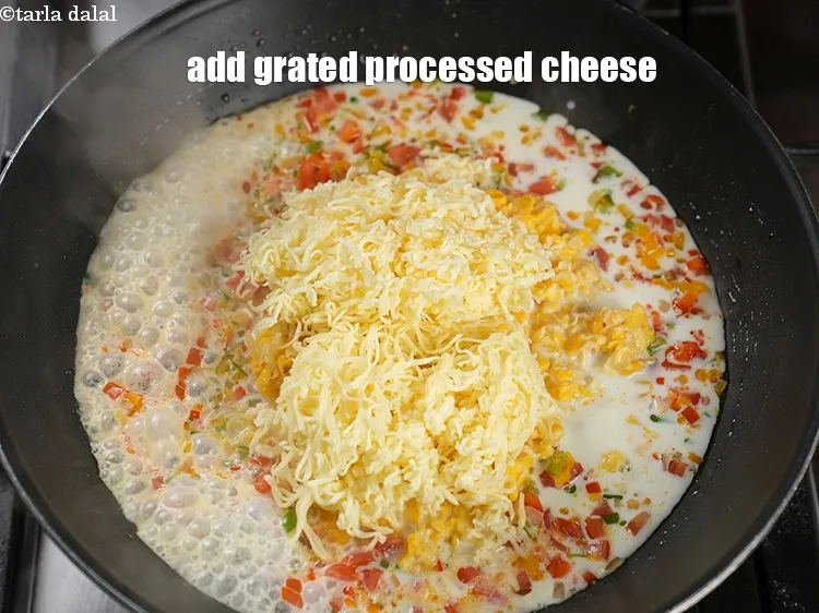Step 16 – Add 1 cup&nbsp;<a href="https://www.tarladalal.com/glossary-grated-processed-cheese-868i">grated processed cheese</a>.
