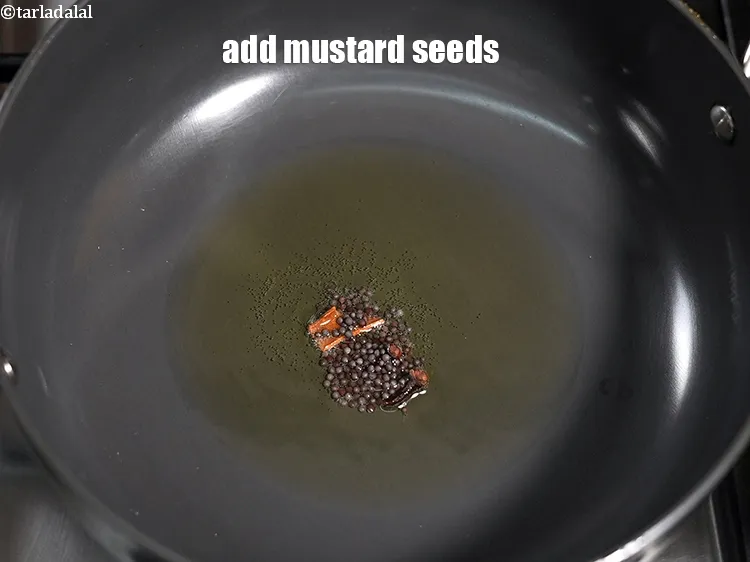 Step 17 – Add &frac14; tsp <a href="https://www.tarladalal.com/glossary-mustard-seeds-sarson-rai-sarson-ke-beej-525i">mustard seeds ( rai / sarson)</a>.&nbsp;