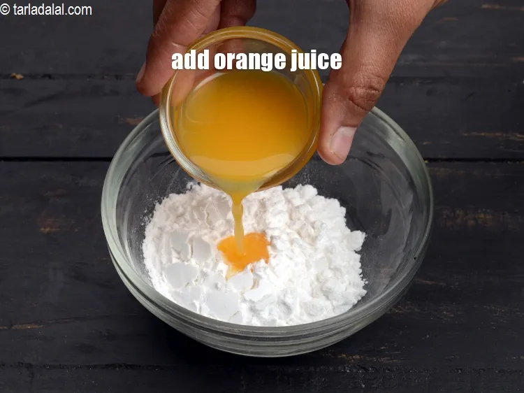 Step 17 – Add 2 tsp&nbsp;<a href="https://www.tarladalal.com/glossary-orange-juice-santre-ka-ras-narangi-ka-juice-118i">orange juice</a>.