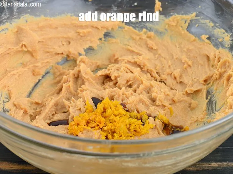 Step 17 – Add 2 tsp <a href="https://www.tarladalal.com/glossary-orange-rind-119i">orange rind</a>.