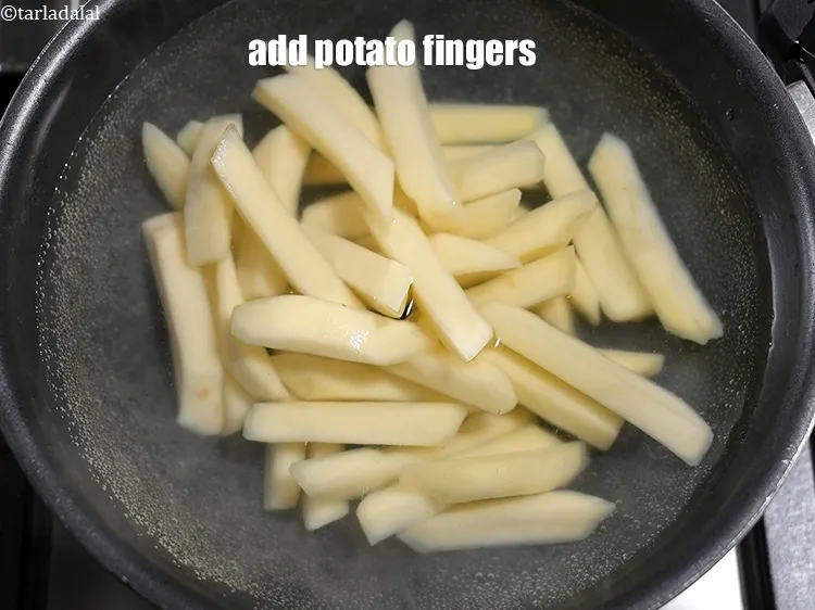 Step 16 – Add 2 cups <a href="https://www.tarladalal.com/glossary-potato-fingers-1065i">potato fingers</a>.