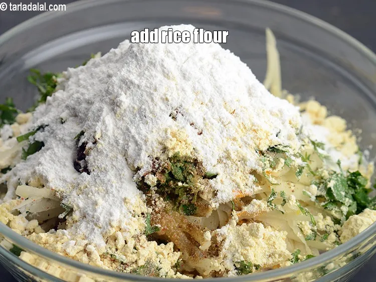 Step 16 – Add 2 tbsp <a href="https://www.tarladalal.com/glossary-rice-flour-chawal-ka-atta-534i">rice flour (chawal ka atta)</a>.