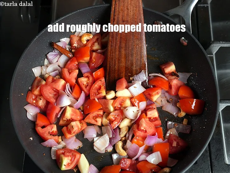 Step 16 – Add 1&frac12; cups roughly <a href="https://www.tarladalal.com/glossary-chopped-tomatoes-779i">chopped tomatoes</a>.