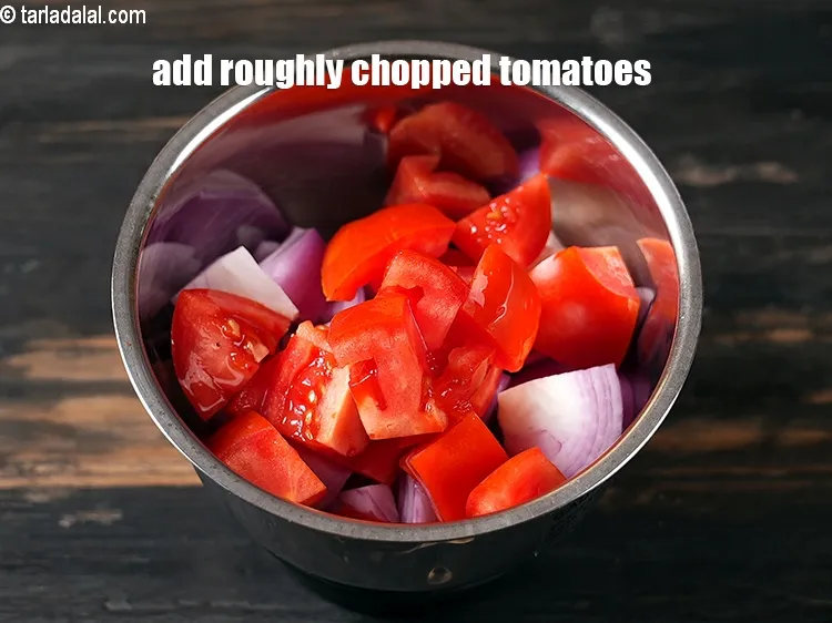 Step 16 – Add &frac34; cup roughly&nbsp;<a href="https://www.tarladalal.com/glossary-chopped-tomatoes-779i">chopped tomatoes</a>.