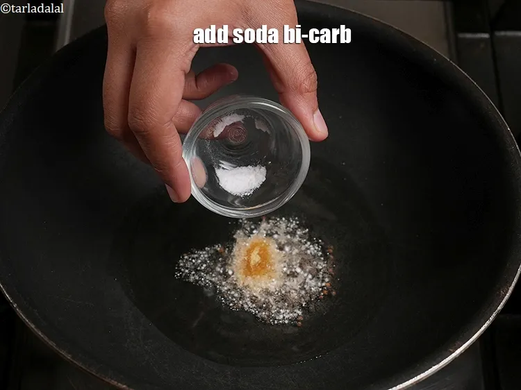 Step 17 – Add a pinch&nbsp;<a href="https://www.tarladalal.com/glossary-baking-soda-soda-bi-carb-615i">soda bi-carb</a>.