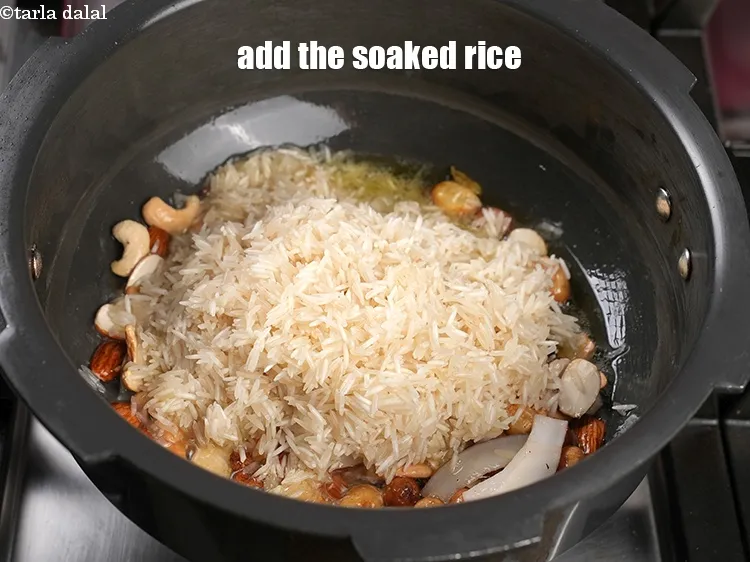 Step 16 – Add the soaked rice.