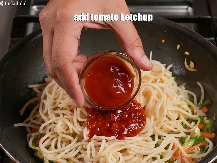 Step 16 – Add 1 tbsp <a href="https://www.tarladalal.com/glossary-tomato-ketchup-tomato-sauce-181i">tomato ketchup</a>.