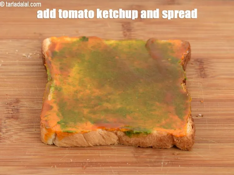 Step 16 – Add &frac12; tsp <a href="https://www.tarladalal.com/glossary-tomato-ketchup-tomato-sauce-181i">tomato ketchup</a> evenly over it.&nbsp;