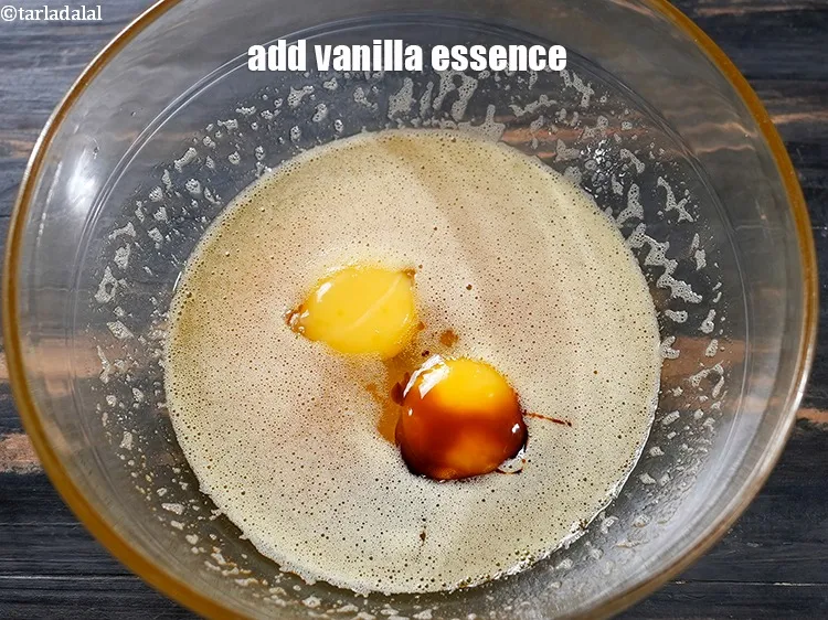 Step 16 – Add 1&frac12; tsp <a href="https://www.tarladalal.com/glossary-vanilla-essence-406i">vanilla essence</a>.