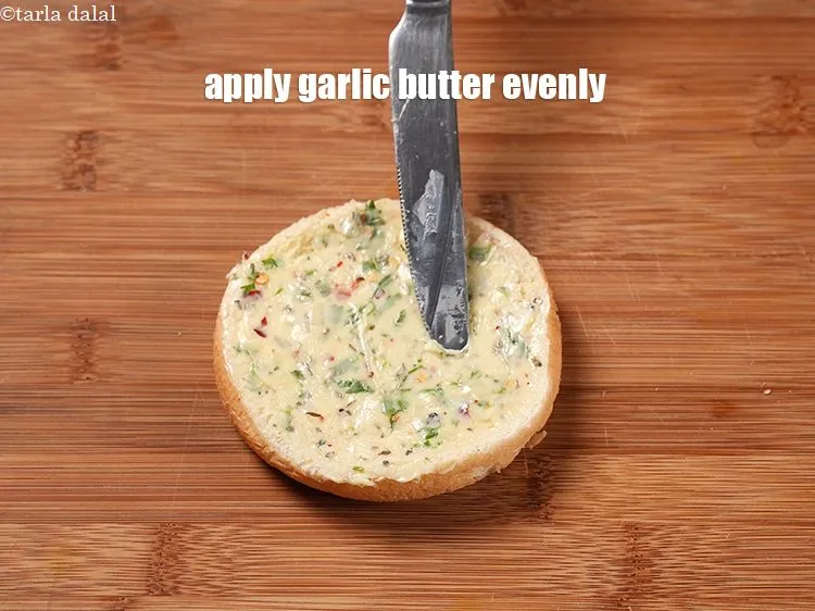 Step 16 – Apply 1 tbsp garlic butter evenly on each halve.